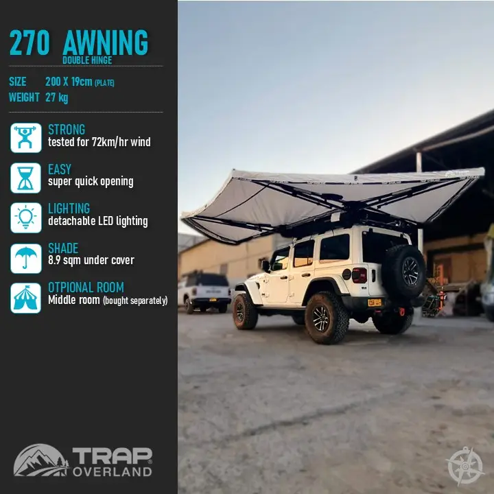 Slide1-3.jpg A rugged off-road vehicle is parked outdoors with a 270 Double Hinge Awning 2.0m providing shade. This overlanding awning offers 72km/h wind resistance, quick opening, LED lighting, and covers 8.9 sqm with an optional room for adventurous excursions.